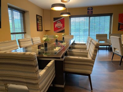 Dining area with a large table and chairs