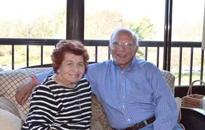 Monroe Village Assisted Living, nursing home in Monroe Township, NJ — Couple smiling together in a cozy indoor setting