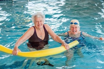 Monroe Village Assisted Living, nursing home in Monroe Township, NJ — Senior residents enjoying water exercise in a swimming pool