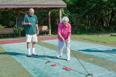 Monroe Village Assisted Living, nursing home in Monroe Township, NJ — Residents enjoying outdoor curling activity at senior living facility