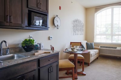 Cozy resident apartment with kitchenette and seating area