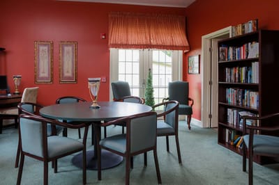 Bright common area with seating and bookshelves