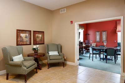 Common area with seating and dining area visible