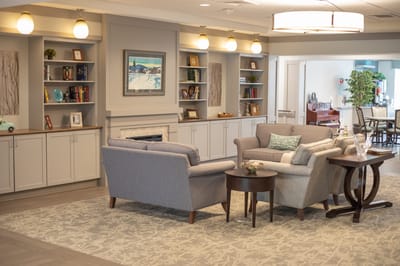 Bright common area with seating and shelves