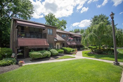 Exterior view of assisted living buildings with green landscaping