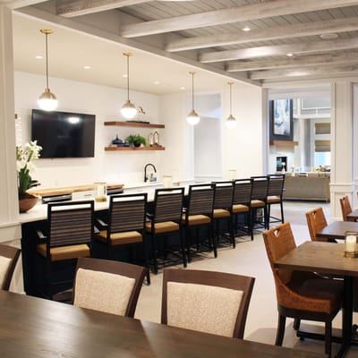 Bright dining room with seating and modern decor