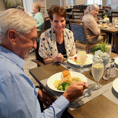 Residents enjoying a meal in the dining room