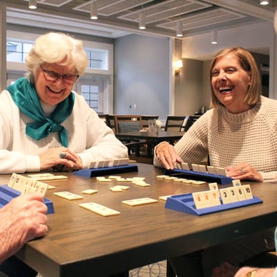 Residents enjoying a game together in a common area