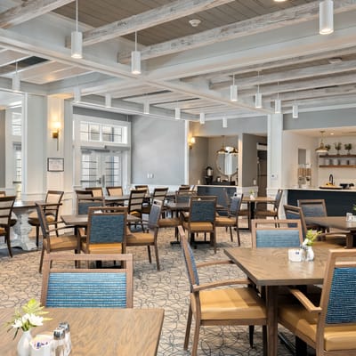 Bright dining area with tables and chairs in an inviting setting