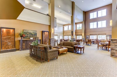 Spacious common area with seating and large windows