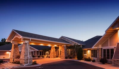 Exterior view of Mission Creek Senior Living at dusk