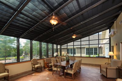 Bright indoor common area with seating and large windows