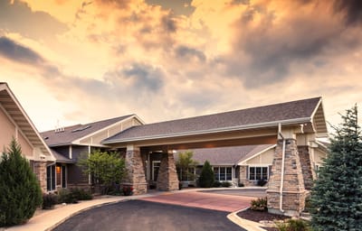 Exterior view of Mission Creek Senior Living at sunset
