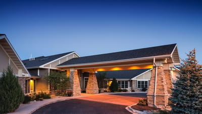 Exterior view of the facility entrance at dusk
