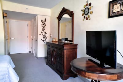 Brightly lit resident room with furniture and decor