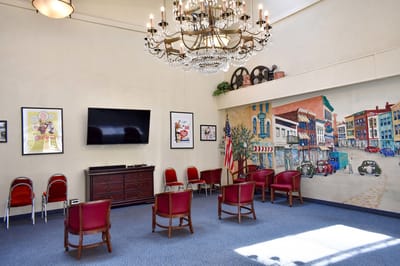 Bright common area with chairs arranged for an event