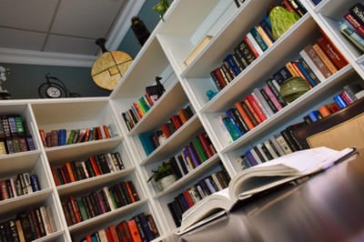 Interior library with bookshelves and a table