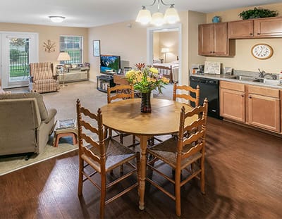Cozy interior of a resident apartment with a dining table