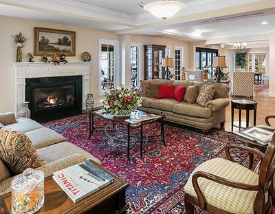 Elegant common area with seating and fireplace.