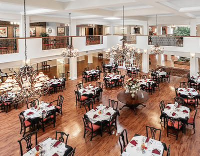 Spacious dining room with elegant table settings