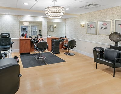 Bright salon area with styling chairs and mirrors