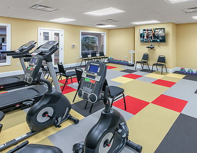 Interior view of a fitness room with exercise equipment