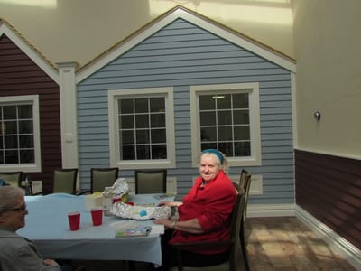 Resident enjoying time in a colorful activity room
