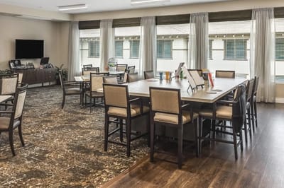 Spacious dining area with tables and chairs
