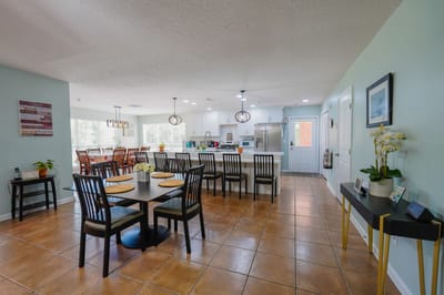 Bright common area with dining and seating arrangement