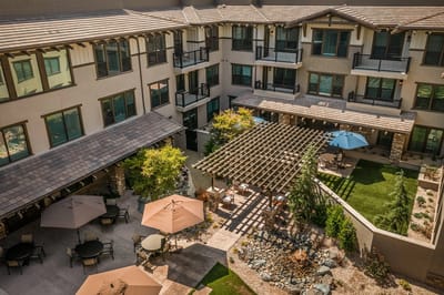 Aerial view of a courtyard with seating and landscaping