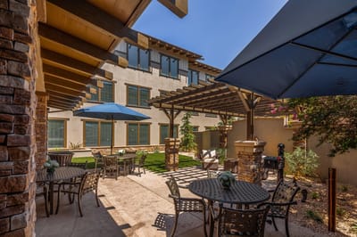 Outdoor patio area with seating and shade structures