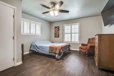 Cozy resident room with a bed and chair