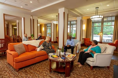 Residents enjoying a social gathering in a common area