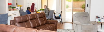 Residents engaged in conversation in a living room