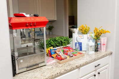 Snack station with popcorn machine and various treats