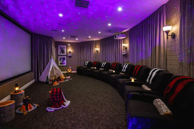 Cozy media room with comfortable seating and ambient lighting