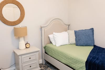 Cozy private room with a bed and nightstand