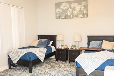 A cozy shared bedroom in a senior living facility