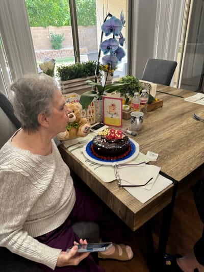 Resident celebrating with a birthday cake