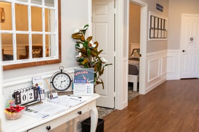 Interior view of a welcoming hallway with decor and signage
