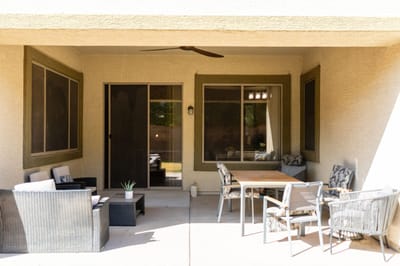 Outdoor patio area with seating and table