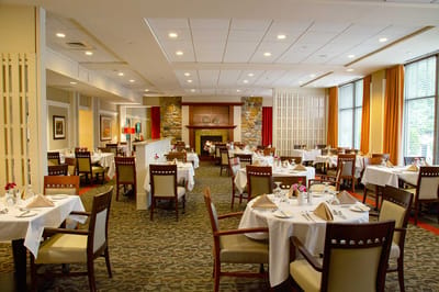 Elegant dining room setup with tables and chairs