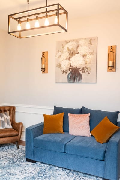 Cozy interior view with a couch and artwork on the wall