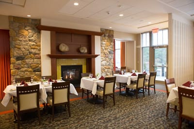 Elegant dining room with tables set for a meal