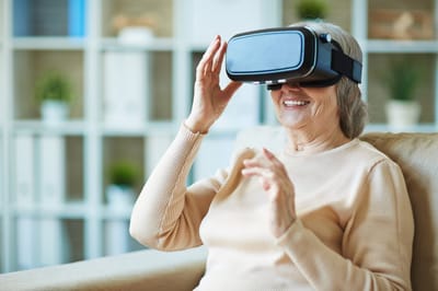 Older adult enjoying virtual reality experience.