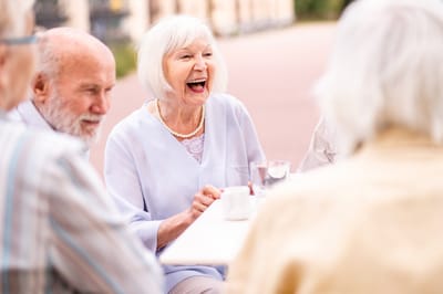Residents enjoying a social gathering outdoors