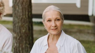 Portrait of a smiling senior woman outdoors.