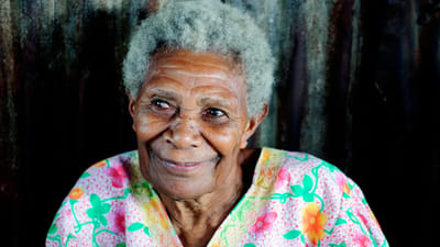 Smiling elderly woman with gray hair