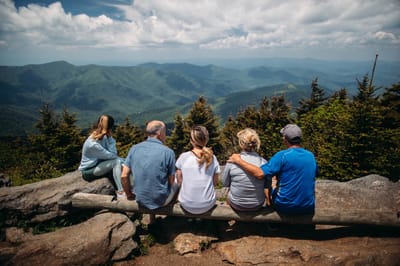 Group of people enjoying a mountain view
