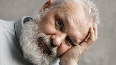 A close-up portrait of a senior man.